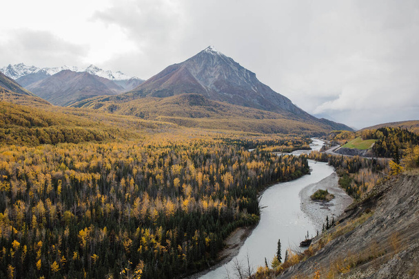 A mountain river in autumn landscape Alaska - 写真・画像