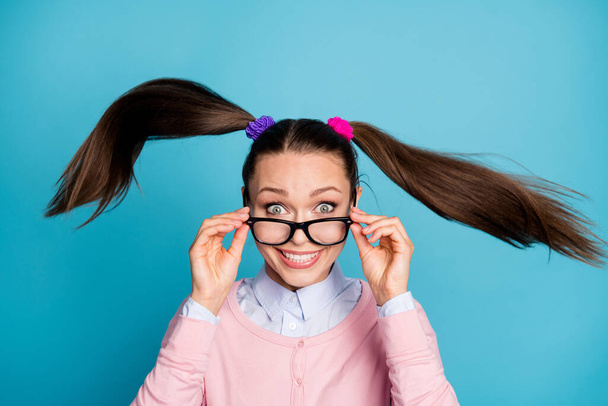 Portrait of crazy positive cheerful girl university student touch specs impressed incredible lesson courses haircut wind blow throw wear shirt isolated over blue color background - Φωτογραφία, εικόνα