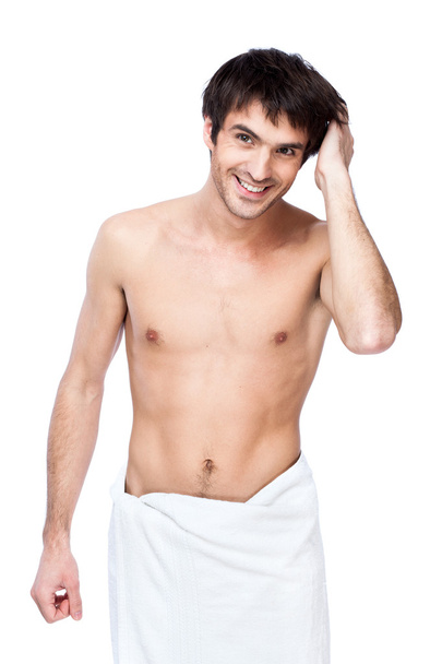 Happy young man with the towel around his waist - Фото, изображение