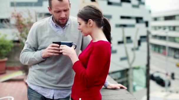 Couple drinking tea on terrace - Πλάνα, βίντεο