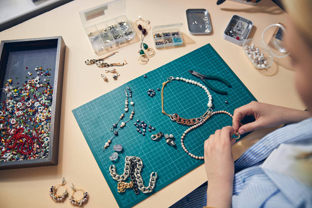 Creation of trendy jewel goods in a studio - Foto, Imagen