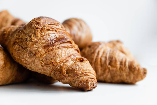 Group of crispy croissants filled with fast absorbing carbohydrates. - Photo, Image