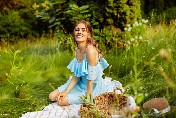 beautiful   woman having picnic  in garden.  - Fotoğraf, Görsel