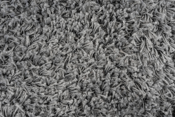 Nero naturale pile tappeto texture sfondo. Tessuto di lana scura. frammento grigio shaggy mat - Foto, immagini