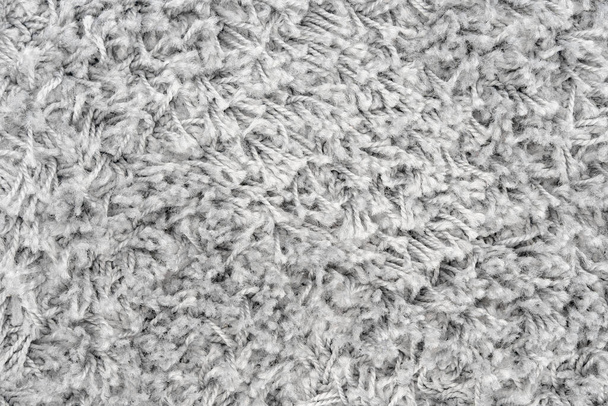 Weiße natürliche Fleece Teppich Textur Hintergrund. Wolle Textur Fragment struppige Matte - Foto, Bild
