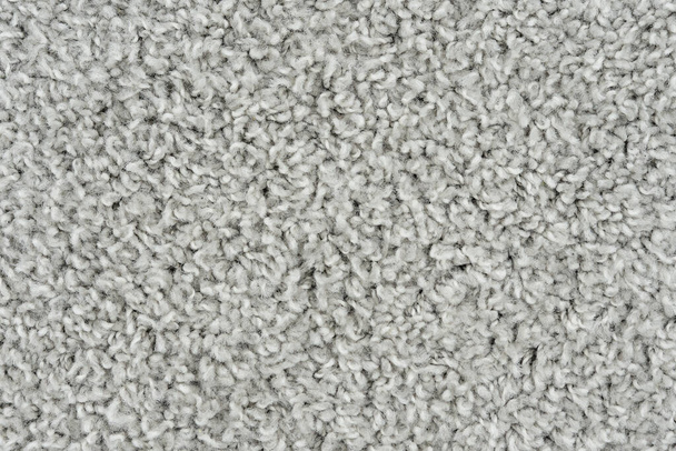 Белый натуральный ковер флис текстуры фона. Ткань шерсти текстура фрагмент лохматый мат - Фото, изображение