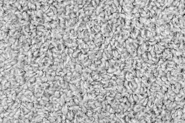 Witte natuurlijke fleece tapijt textuur achtergrond. Wol stof textuur fragment shaggy mat - Foto, afbeelding