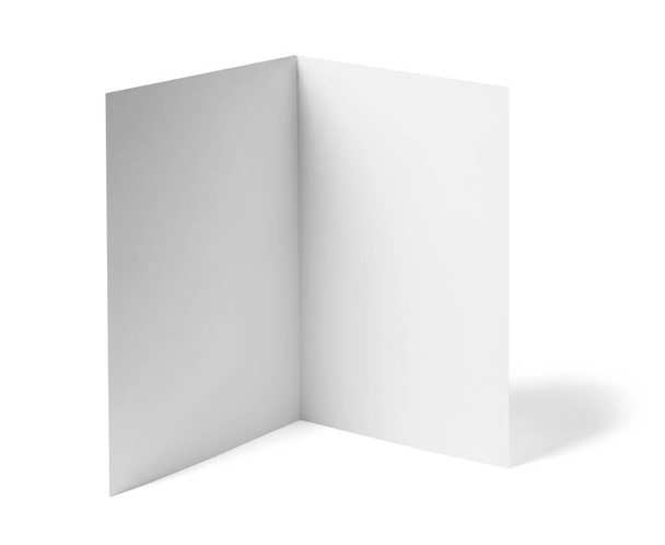 közel egy üres hajtogatott szórólap fehér könyv fehér háttér  - Fotó, kép