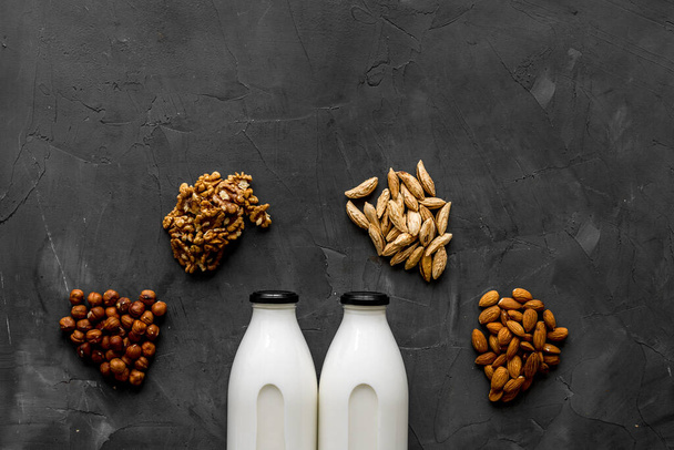 Vegan alternative nuts milk in bottles. Above view - Fotografie, Obrázek