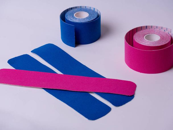 colorful kinesiology tape. Physiotherapy and therapeutic tape for wrist pain, aches and tension. elastic therapeutic tape. adhesive tape and alternative medicine. - Photo, Image