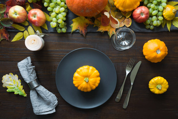 Fall table place setting decorated vegetables, grape, pumpkins, aplles, harvest. Thanksgiving Day - Photo, image