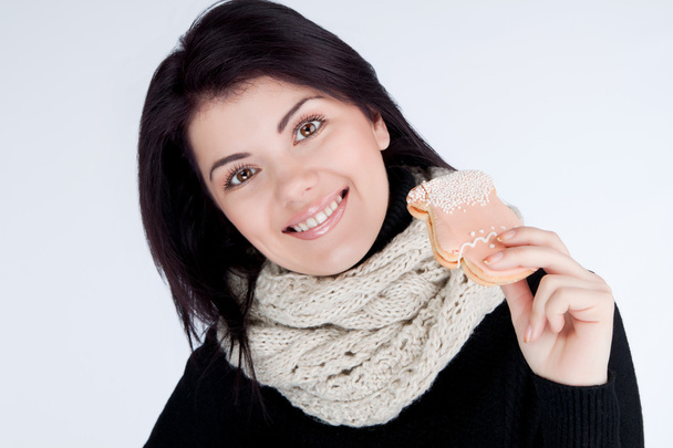 Portrait of a girl wearing a scarf with cookies - Foto, imagen
