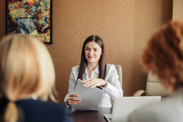 Getting a new job concept. Job interview with woman applicant in office. - Foto, afbeelding