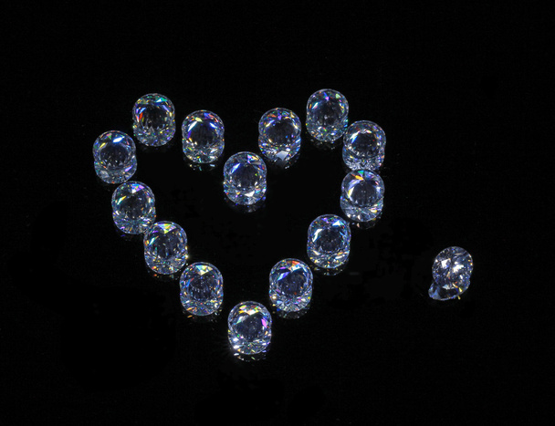 Crystal Heart. Round phianites on black mirror - Photo, Image