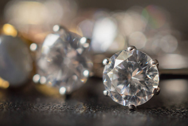 Jewelry diamond rings set on black background close up - 写真・画像