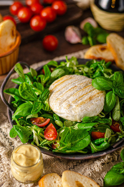 Fresh salad with grilled camembert and dijon mustard - Photo, image