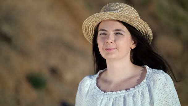 Portrait of beautiful woman in white dress looks asides thoughtfully - Footage, Video