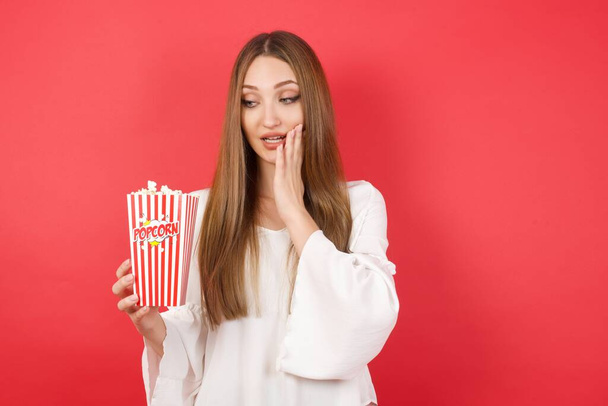 Young beautiful woman with popcorn - Photo, Image