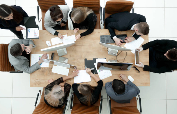 top view. working group discussing business documents - 写真・画像