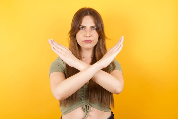 beautiful young woman crossing arms doing negative sign, angry face - Photo, Image