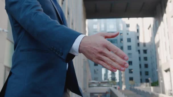 Close up of the hands of top managers in business suits, shake hands with each other, at Business center background, agree to a deal. Unrecognizable persons. - Footage, Video
