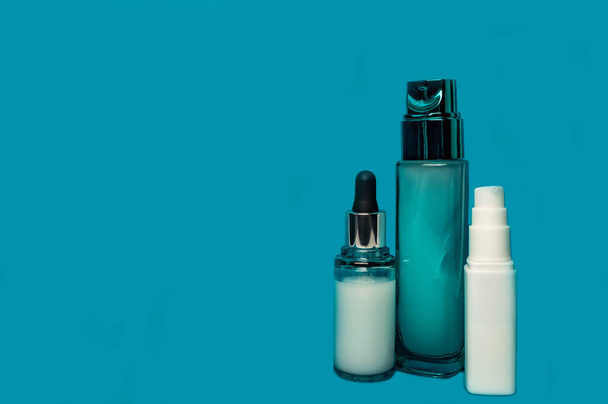 glass and plastic bottles with cosmetic serum dispenser - Fotoğraf, Görsel