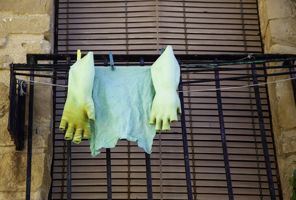 Gloves and rags hanging for cleaning, disinfection and hygiene - Photo, Image