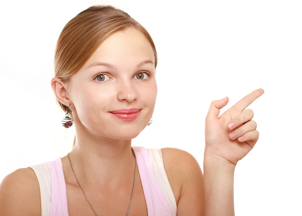 Young woman pointing at something - Foto, Bild