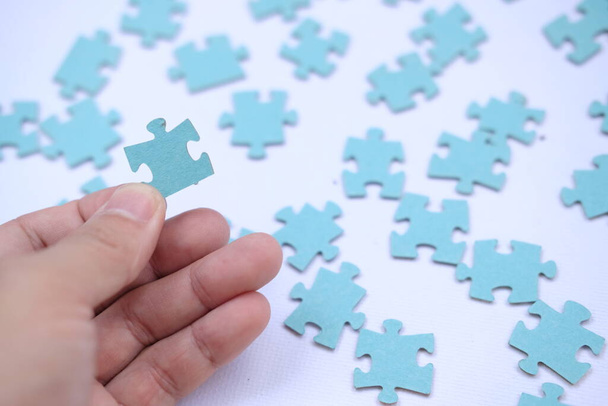 Businessman hands connecting jigsaw puzzle. Business solutions, success and strategy concept. Businessman concept. jigsaw background - Photo, Image