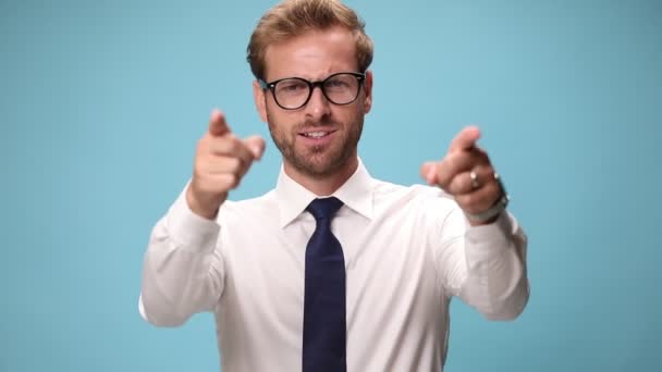 sexy businessman pointing at camera, pointing at himself, waving his fists and being overly excited on blue background - Footage, Video
