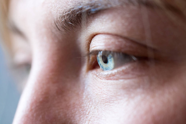 Feminine eyes, with blue iris, cut out of the face, healthcare - 写真・画像
