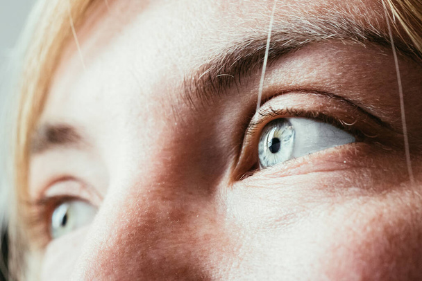 Feminine eyes, with blue iris, cut out of the face, healthcare - Zdjęcie, obraz
