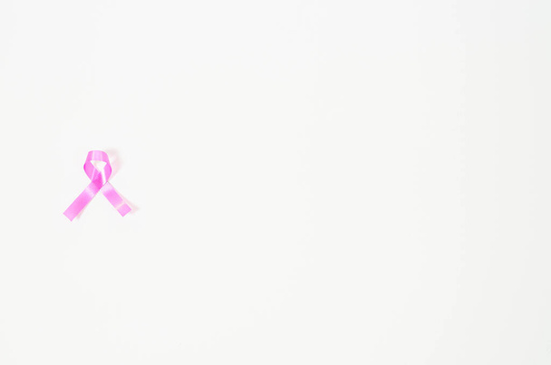 Pink ribbon isolated on a white background.Copy space.World Breast Cancer Day Concept. - Fotoğraf, Görsel
