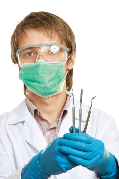 Male dentist with medical tools - Foto, Bild