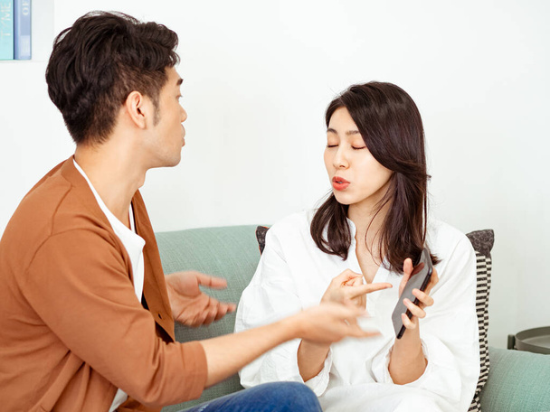 Young Couple Have Disagreement at Home. - 写真・画像