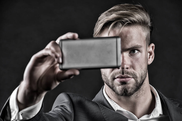 Man manager with mobile phone make selfie - 写真・画像