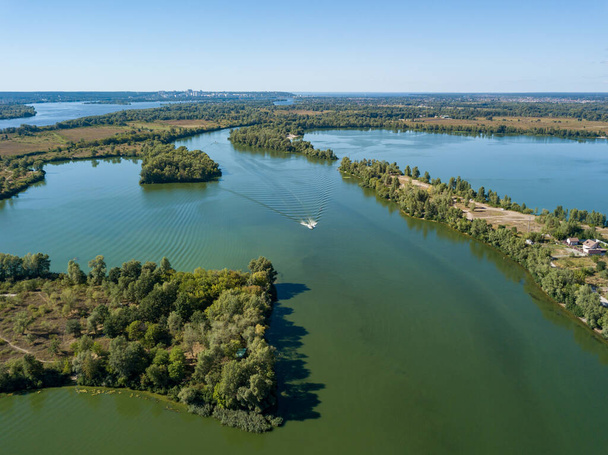 Panoramic view of the Dnieper river in Kiev. Sunny clear day. Aerial drone view. - Photo, Image