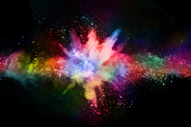 abstract colored dust explosion on a black background.abstract powder splatted background,Freeze motion of color powder exploding/throwing color powder, multicolored glitter texture. - Photo, Image