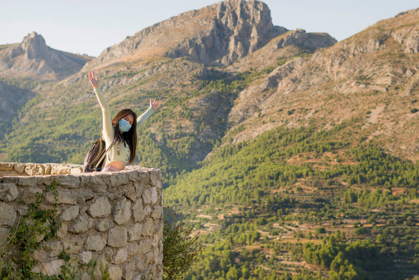 lifestyle portrait  of young happy and cheerful Asian Chinese tourist woman visiting Spain during Summer holidays travel hiking and enjoying nature from beautiful viewpoint - Foto, afbeelding