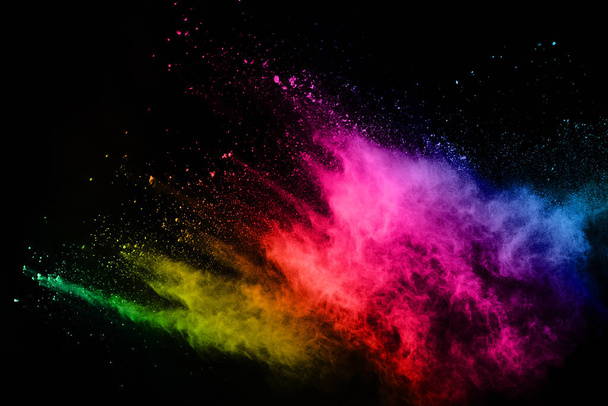 abstract colored dust explosion on a black background.abstract powder splatted background,Freeze motion of color powder exploding/throwing color powder, multicolored glitter texture. - Foto, immagini