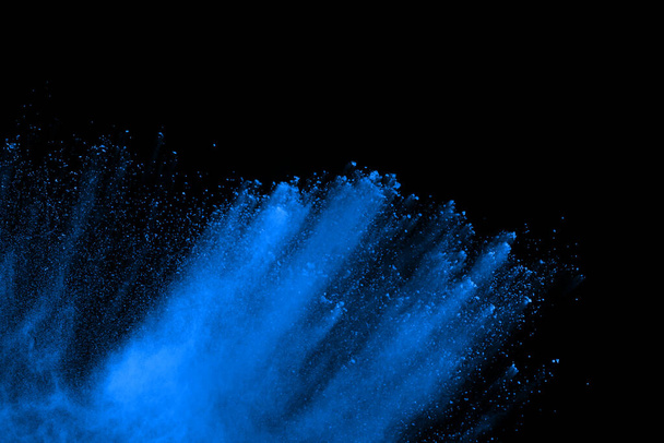 Blue powder explosion on black background. Colored cloud. Colorful dust explode. Paint Holi. - Photo, image