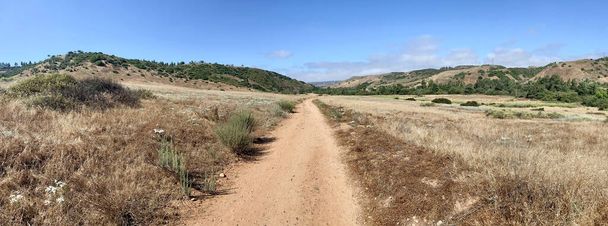 Panoramic view of small dry dusty trails in the valley - Photo, Image