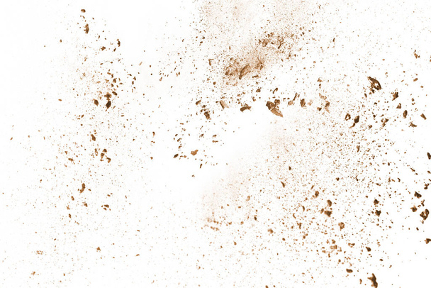 Brown color powder explosion on white background. Colored cloud. Colorful dust explode. Paint Holi. - Фото, зображення