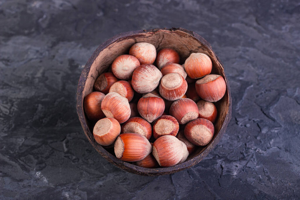 Whole coconut-shelled hazelnuts - Фото, изображение