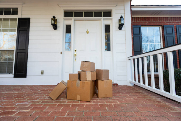 Shipping boxes on front porch of home - Photo, Image