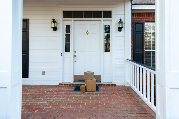 Packages on front porch of home - Фото, изображение