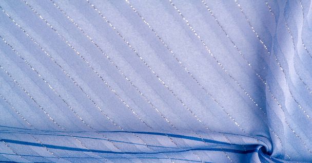Textura de diseño de fondo, tejido azul con rayas azules y blancas de lurex, perfecto para un estilo fresco y cómodo.  - Foto, Imagen