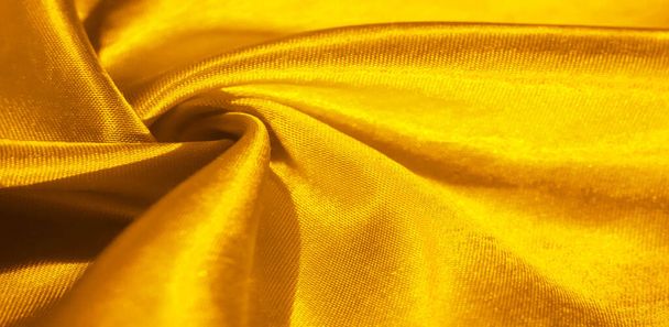 Текстура, фон, узор, шелковая ткань желтого цвета. Этот восхитительный, мягкий и блеск имеет гладкую норковую поверхность, идеально подходящую для создания ваших проектов. - Фото, изображение