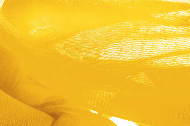 Texture. Background fabric of silk yellow matte color (paint or surface) is dull and flat, without shine. - Fotoğraf, Görsel