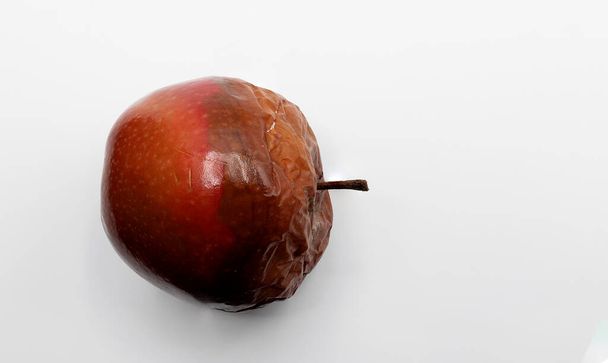 rotten apple, bad apple, moldy apple, white background - Photo, Image